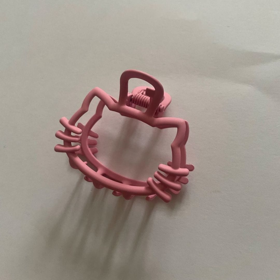 Pink Hello Kitty hair clip shaped like the character's face - Beads by Nia