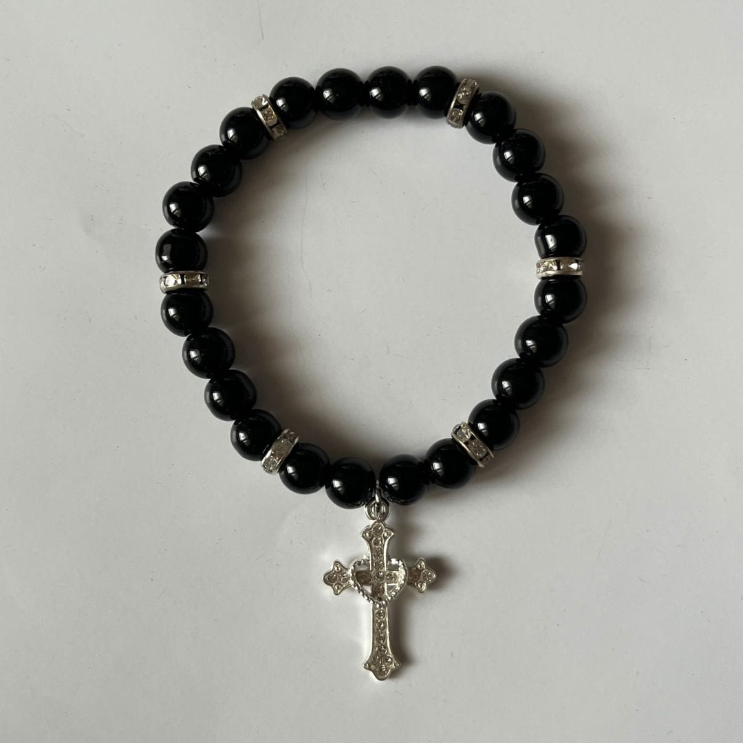 Black cross bracelet in glossy black beads with a silver cross charm - Beads by Nia