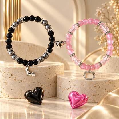 Black Batman and pink Hello Kitty bracelets on stone with heart props - Beads by Nia