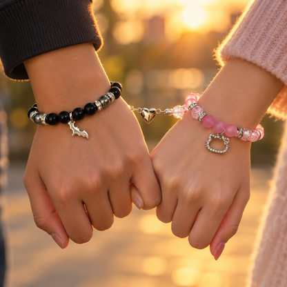 Couple holding hands at sunset in Batman and Hello Kitty bracelets - Beads by Nia