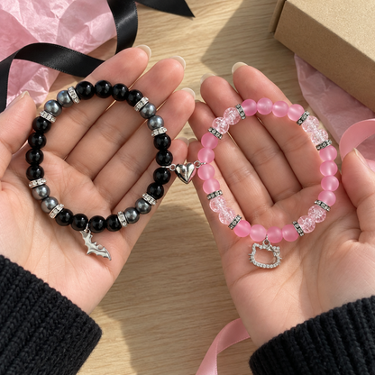 Hands holding Batman and Hello Kitty matching bracelets with gift box - Beads by Nia