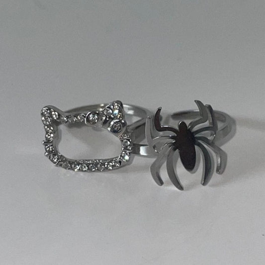 Crystal Hello Kitty ring and black spider ring shown side by side - Beads by Nia