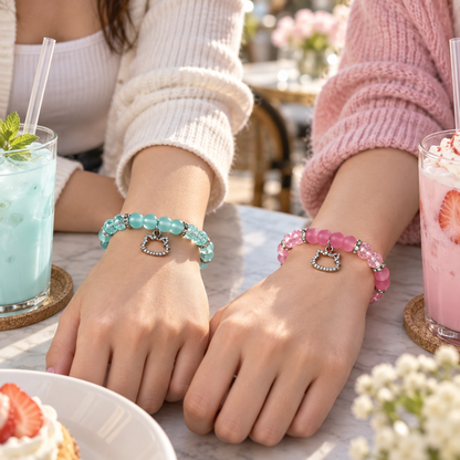 Friends wearing Hello Kitty and Dear Daniel bracelets over drinks at a cafe - Beads by Nia