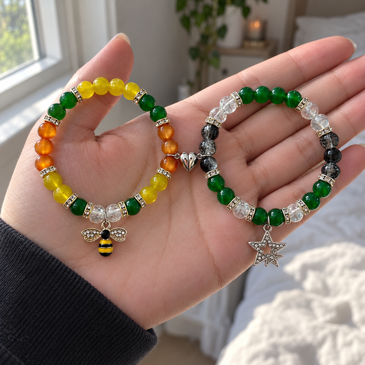 Hand holding yellow Flower Boy and green Chromakopia bracelets - Beads by Nia