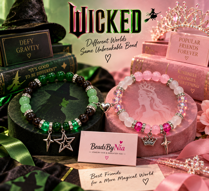 Green and pink Wicked matching bracelets on a display stand with star charms - Beads by Nia
