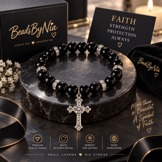 Black beaded cross bracelet on a dark podium with a crystal cross - Beads by Nia