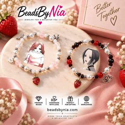 Nana and Hachi bracelet pair on pink silk with strawberry charms and gift tag