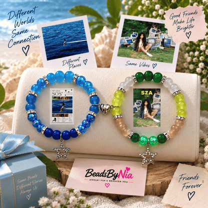 Blue and green SZA beaded bracelets with album art charms on a seaside display - Beads by Nia