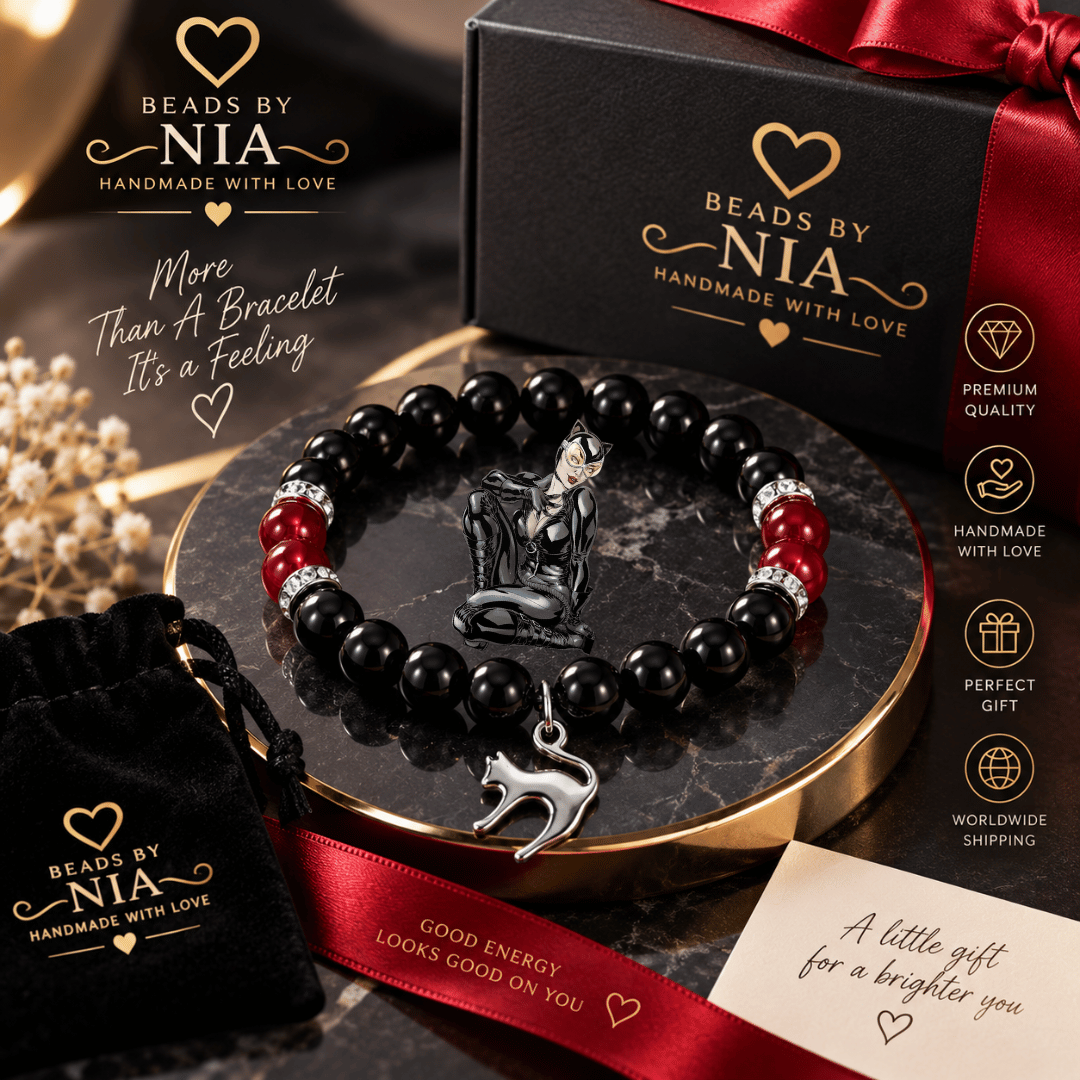 Catwoman bracelet in black beads with a silver cat charm in a gift box with rose
