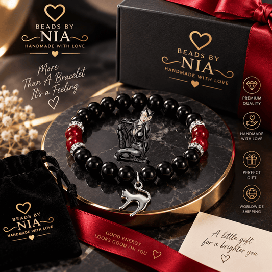 Catwoman bracelet in black beads with a silver cat charm in a gift box with rose