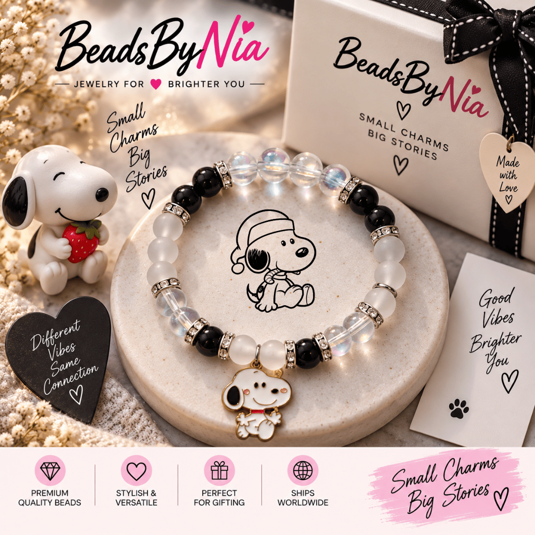 Snoopy bracelet on a cream tray with a Snoopy plush and gift cards - Beads by Nia