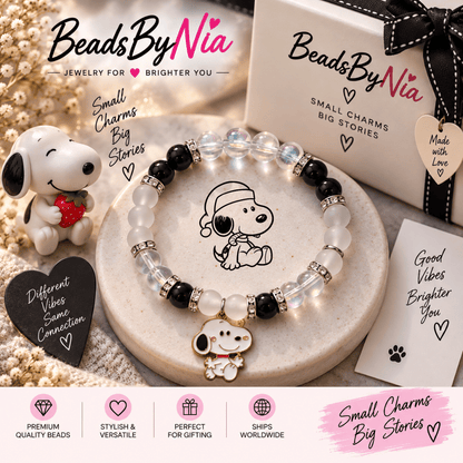 Snoopy bracelet on a cream tray with a Snoopy plush and gift cards - Beads by Nia