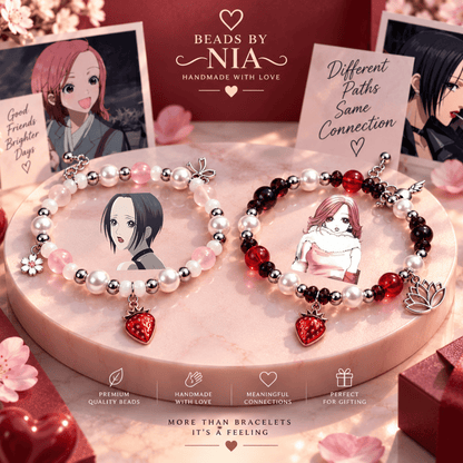 Nana and Hachi matching bracelets on a pink podium with anime art cards