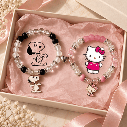 Snoopy and Hello Kitty beaded bracelets on pink tissue in a gift box - Beads by Nia