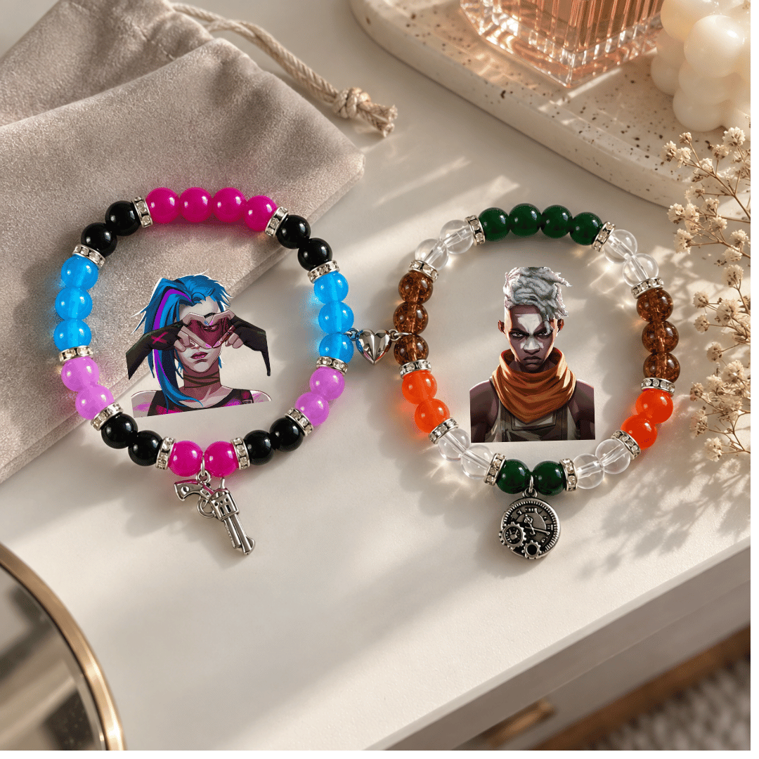 Jinx and Ekko Arcane matching bracelets displayed with gold decor - Beads by Nia