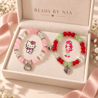 Hello Kitty and Strawberry Shortcake bracelets in a cream gift box with ribbon - Beads by Nia