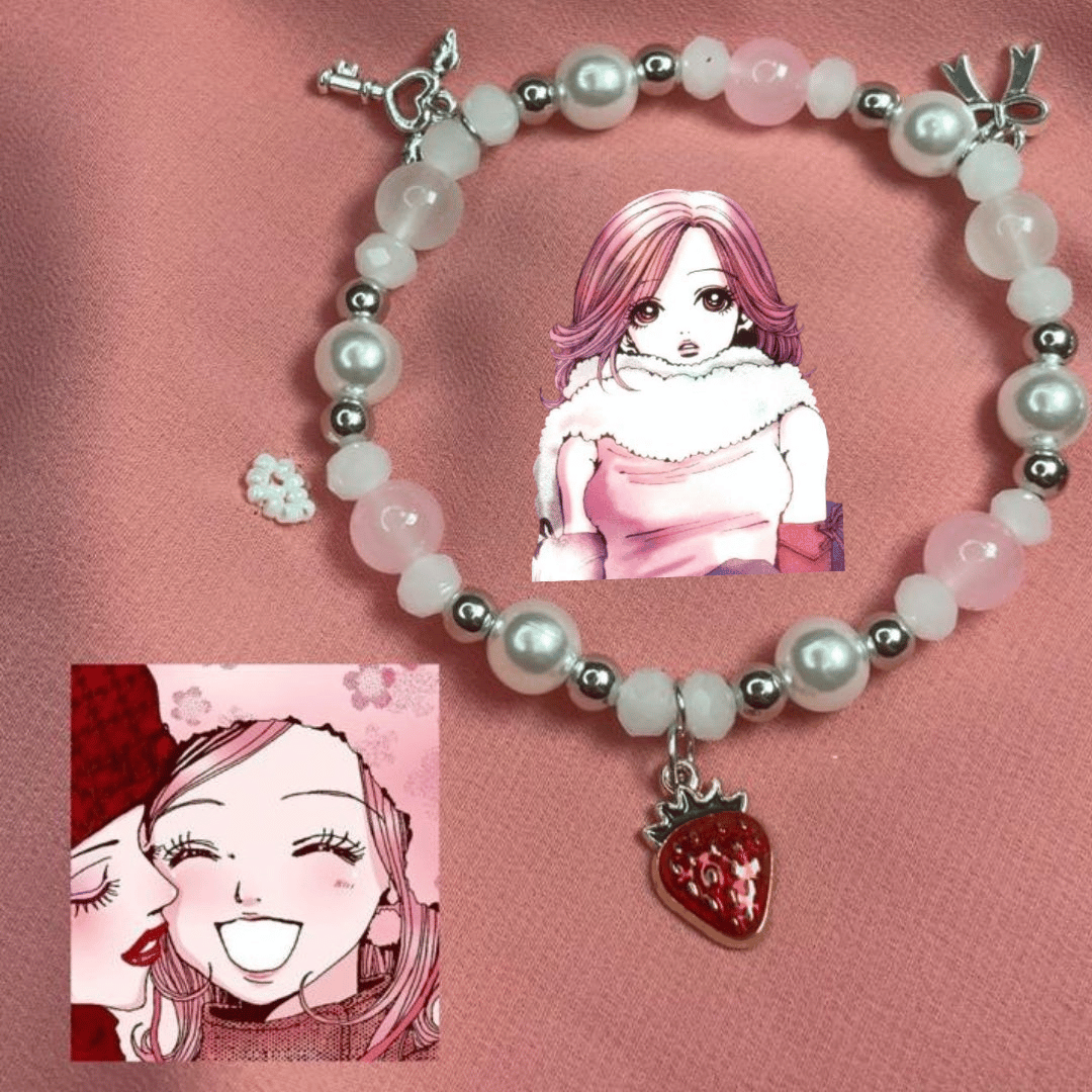 Hachi pink pearl bracelet with anime art and a red strawberry charm on pink silk