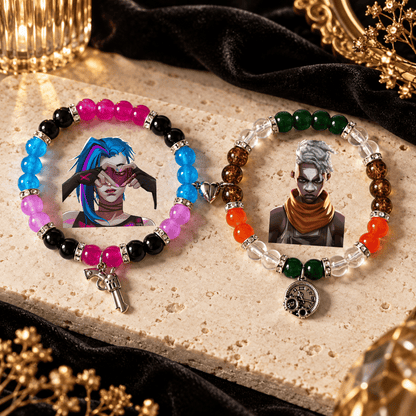 Jinx and Ekko beaded bracelets on cream stone with gun and clock charms - Beads by Nia