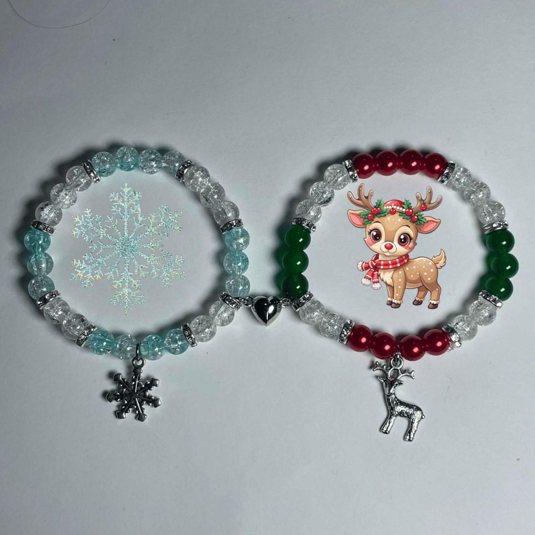 Snowflake and reindeer beaded bracelets side by side with silver festive charms - Beads by Nia