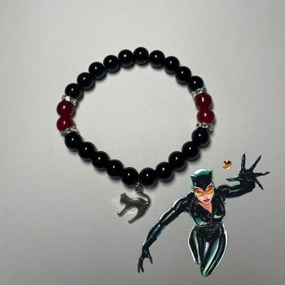 Catwoman bracelet in black beads with a silver cat charm, handmade DC fan jewellery - Beads by Nia