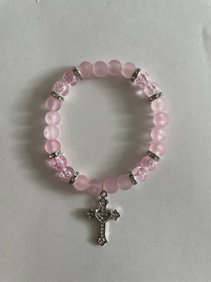 Pink cross bracelet in pale pink beads with a silver cross charm - Beads by Nia